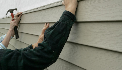 How can you estimate the cost of installing house siding?